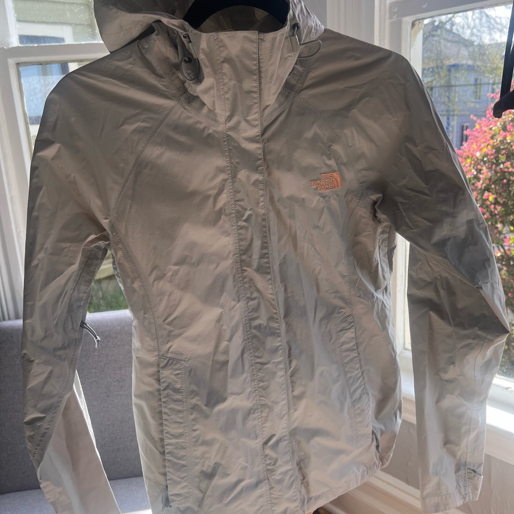 The North Face Gray Windbreaker Jacket with Hood and Water-Resistant Material